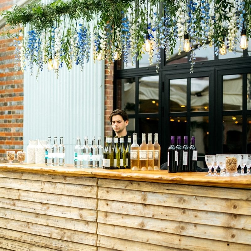 wooden bar with wine bottles