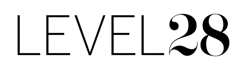 A simple tree icon with a symmetrical design, featuring a large circular canopy above a straight trunk, all in black on a white background.