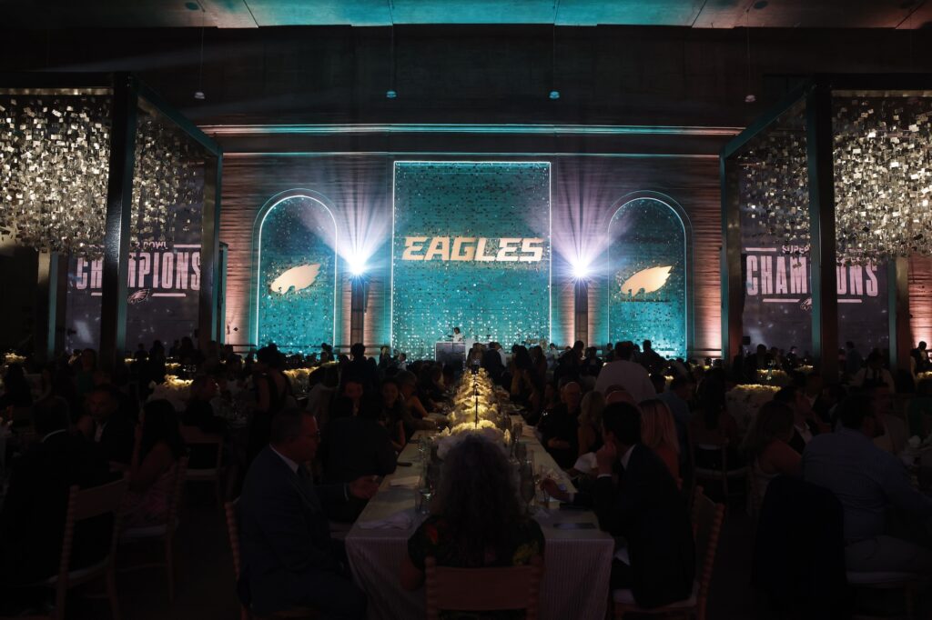 A large banquet hall filled with people dining, with 